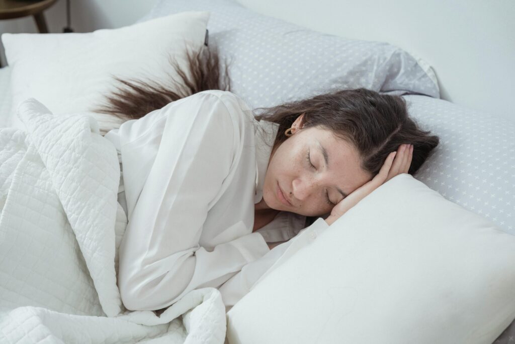 Picture showing a lady relaxing in a spacious room at Spark by Hilton after a long day at the amusement park