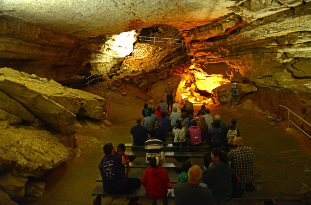 Image of guests seated inside Mammoth Cave in Kentucky in readiness to return to the nearest best hotel in Kentucky