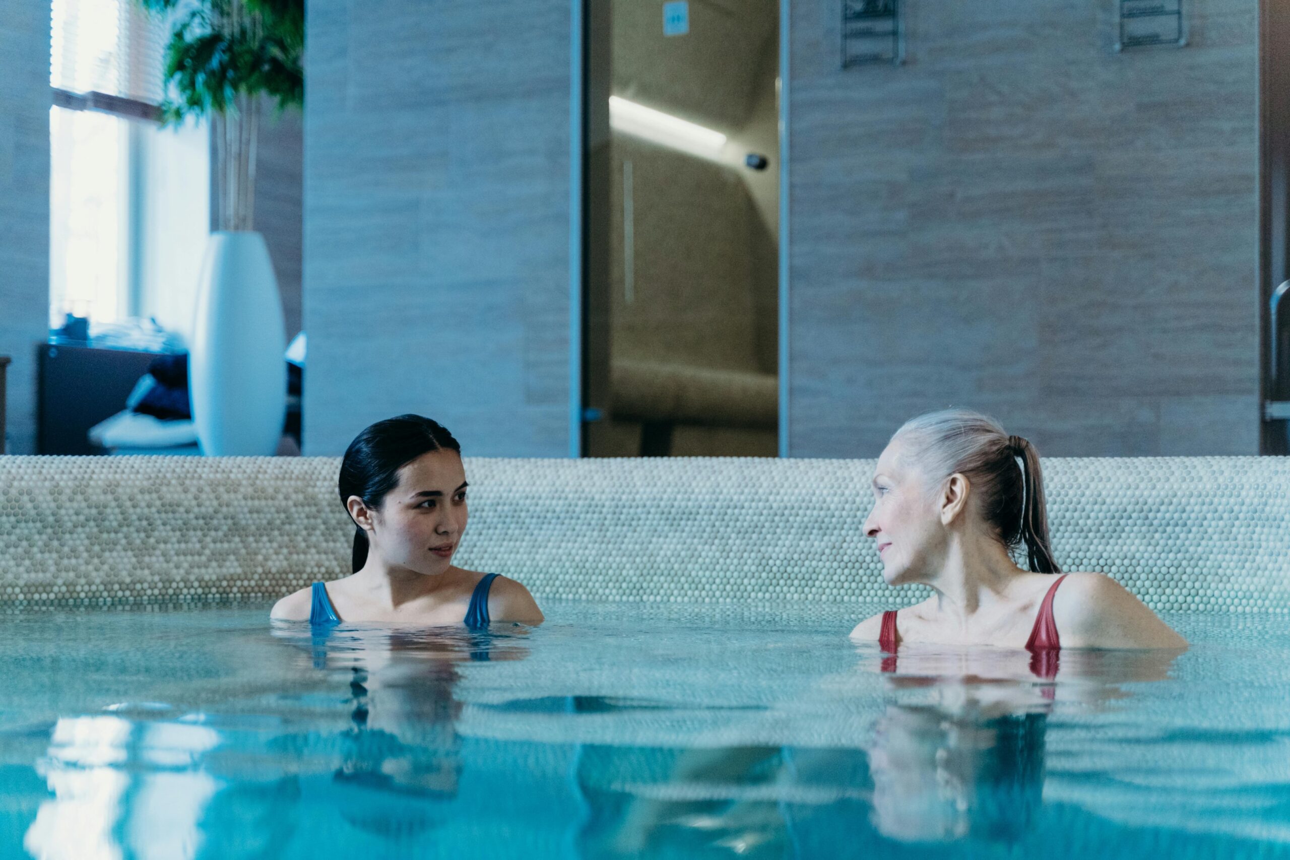 Picture of two ladies in an indoor swimming pool