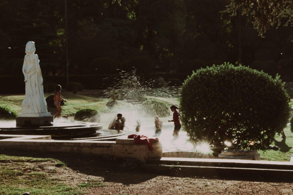 A mum playing with her children in the swimming pool