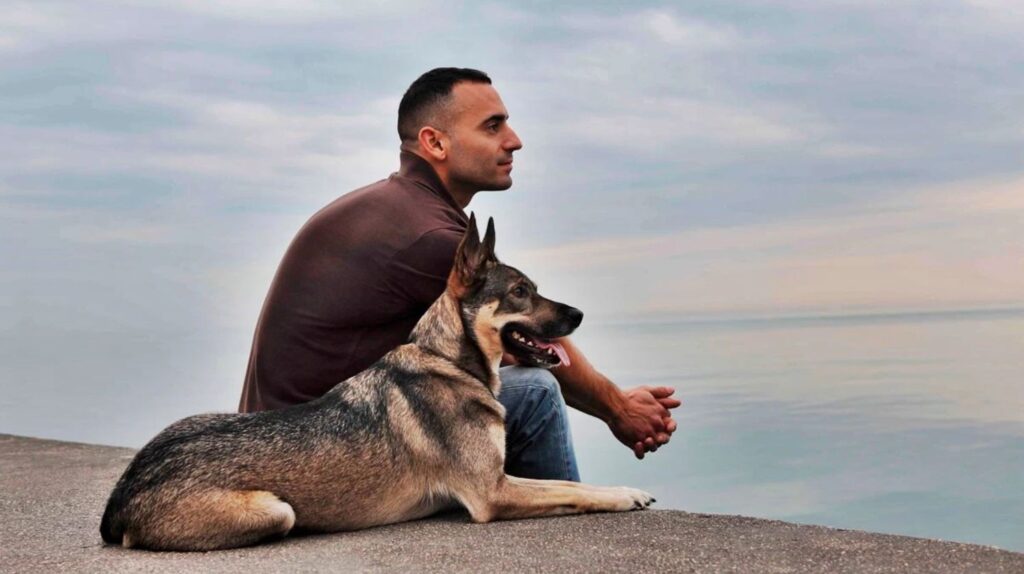 Pet dog and man by the lake in somerset close to somerset hotels ky